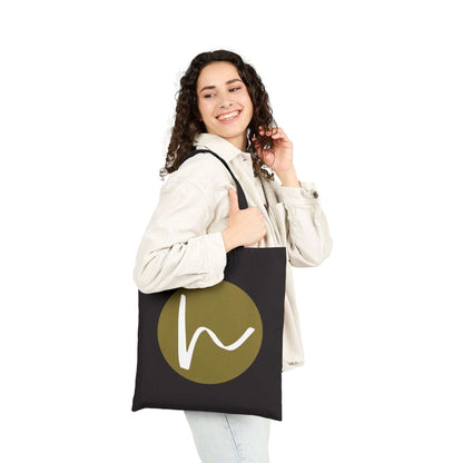 Custom Cotton Canvas Tote Bag – Upload Your Own Design being carried by a smiling woman with a stylish logo.