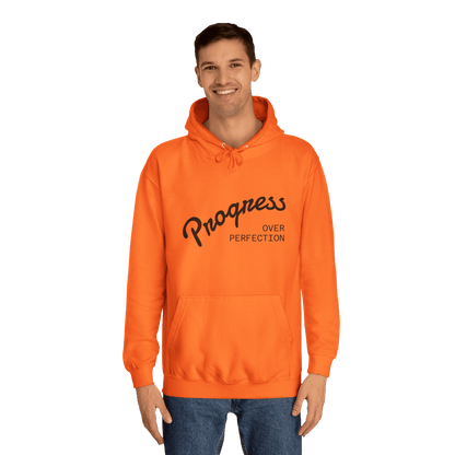 Custom College Hoodie – Add Your Photos, Text & Emojis Your Way worn by a man in an orange hoodie with the text "Progress Over Perfection."