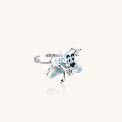 Dreamy Panda Flower Ring featuring a panda on blue petals and zirconia crystal crown, gold-plated brass design.