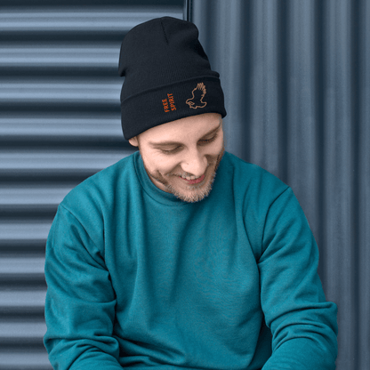 Eagle Beanie – Embroidered Knit Hat with Custom Text worn by a smiling man in a teal sweater.