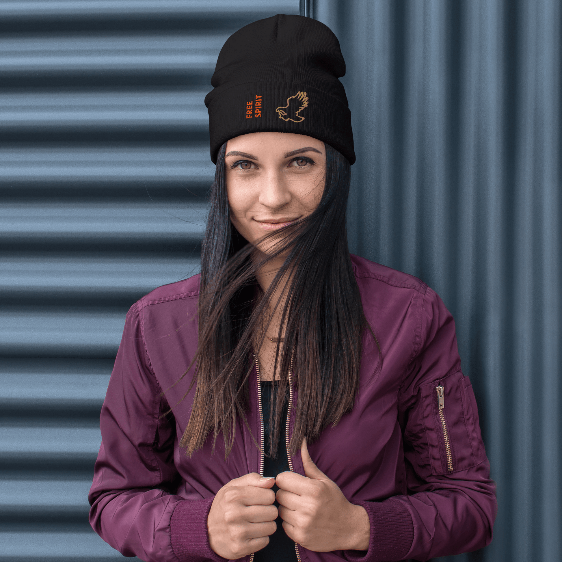 Eagle Beanie – Embroidered Knit Hat with Custom Text worn by a woman in a stylish purple jacket, showcasing its bold design.