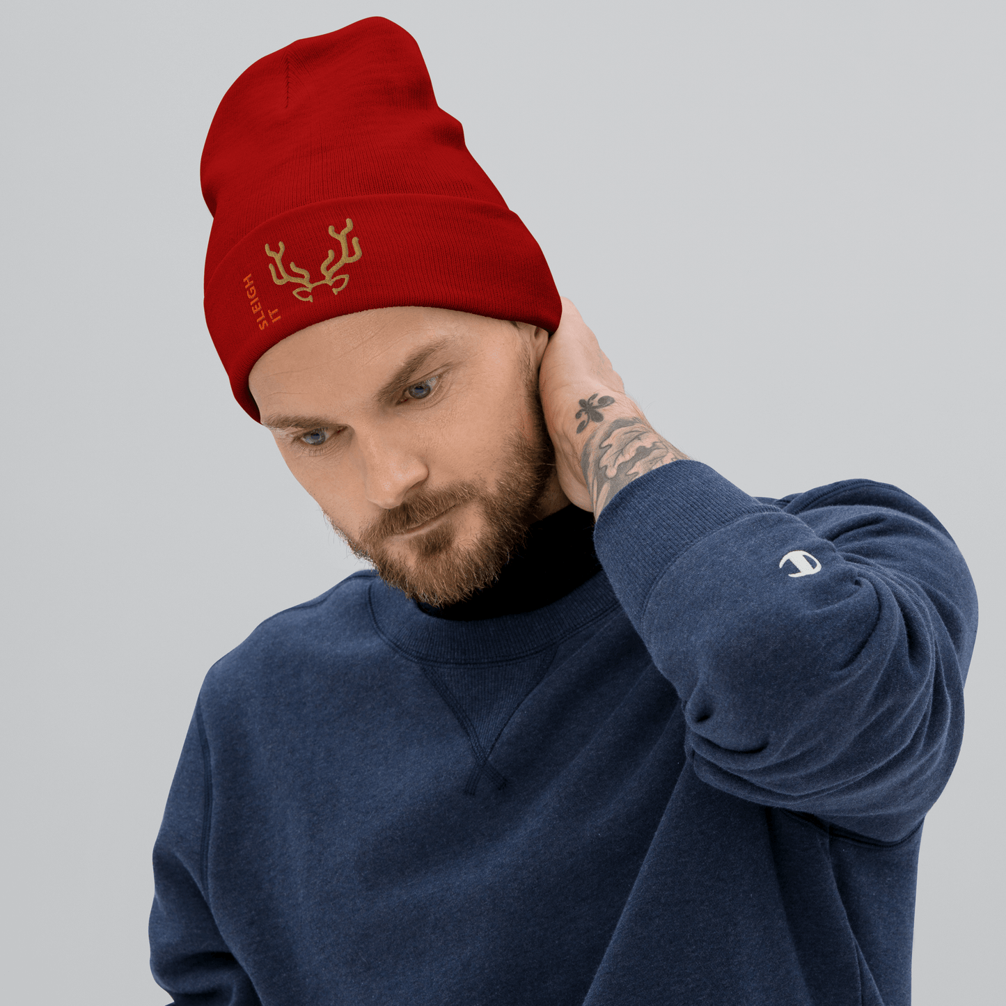 Embroidered Beanie – Cozy Personalized Winter Hat worn by a man in a red beanie and navy sweatshirt, showcasing warmth and style.