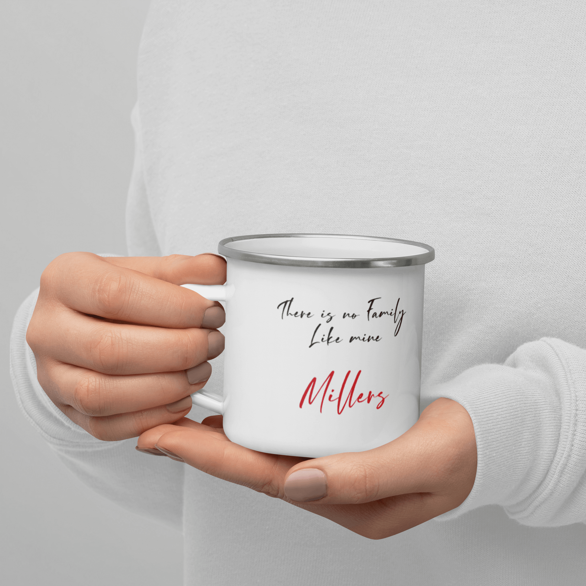 Custom Family Mug – Personalized Crossword Enamel Cup for Gifting held in a person's hand with a custom family name.