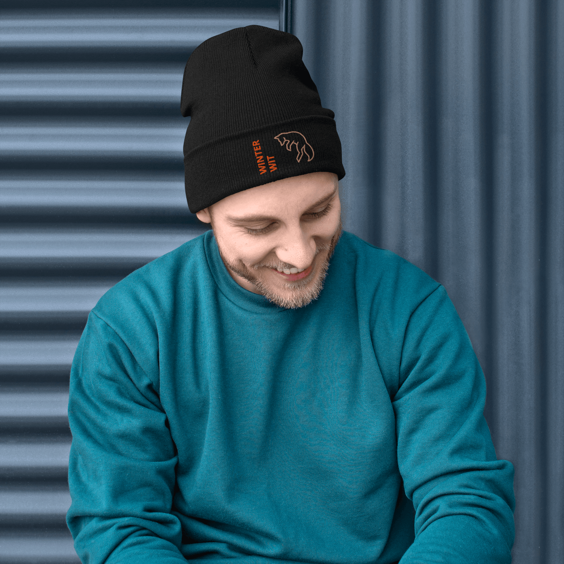 Man wearing a warm Fox Beanie – Embroidered Knit Hat with Custom Text, showcasing its stylish design.