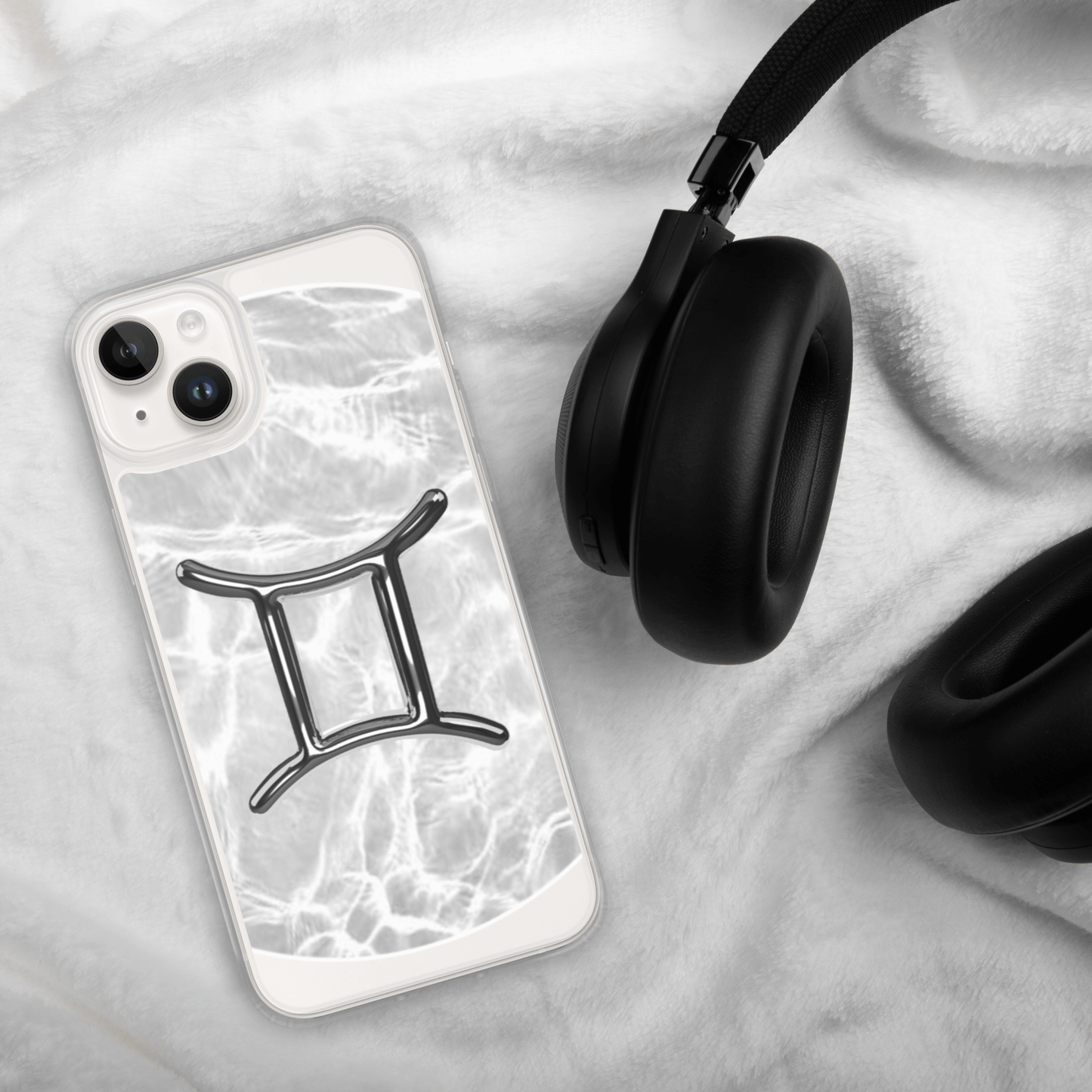 Zodiac Gemini Magsafe clear iPhone case on soft fur with headphones, featuring marble metallic design.