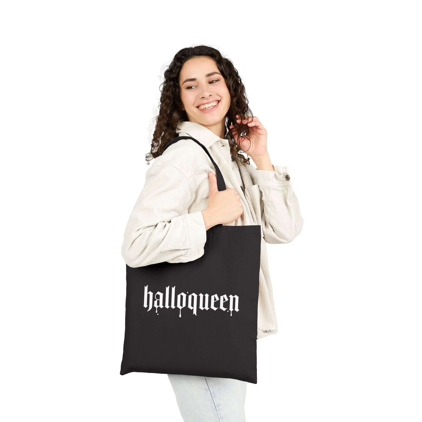 Double-Sided Halloween Tote – “Here for the Boos” + Spooky Vibes held by a woman showcasing the 'halloqueen' design.