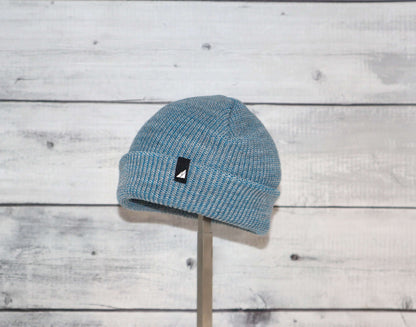 Infant Acrylic Cuff Hat – Soft Knit Beanie for Ages 3–12M in blue color on a wooden background.