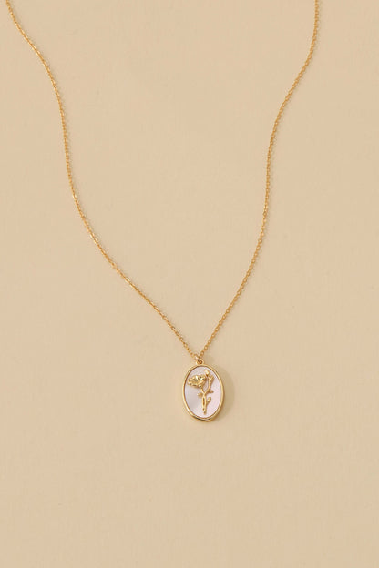Katrina Birth Flower Necklace – Gold-Filled & Mother of Pearl, featuring an oval pendant with floral engraving.