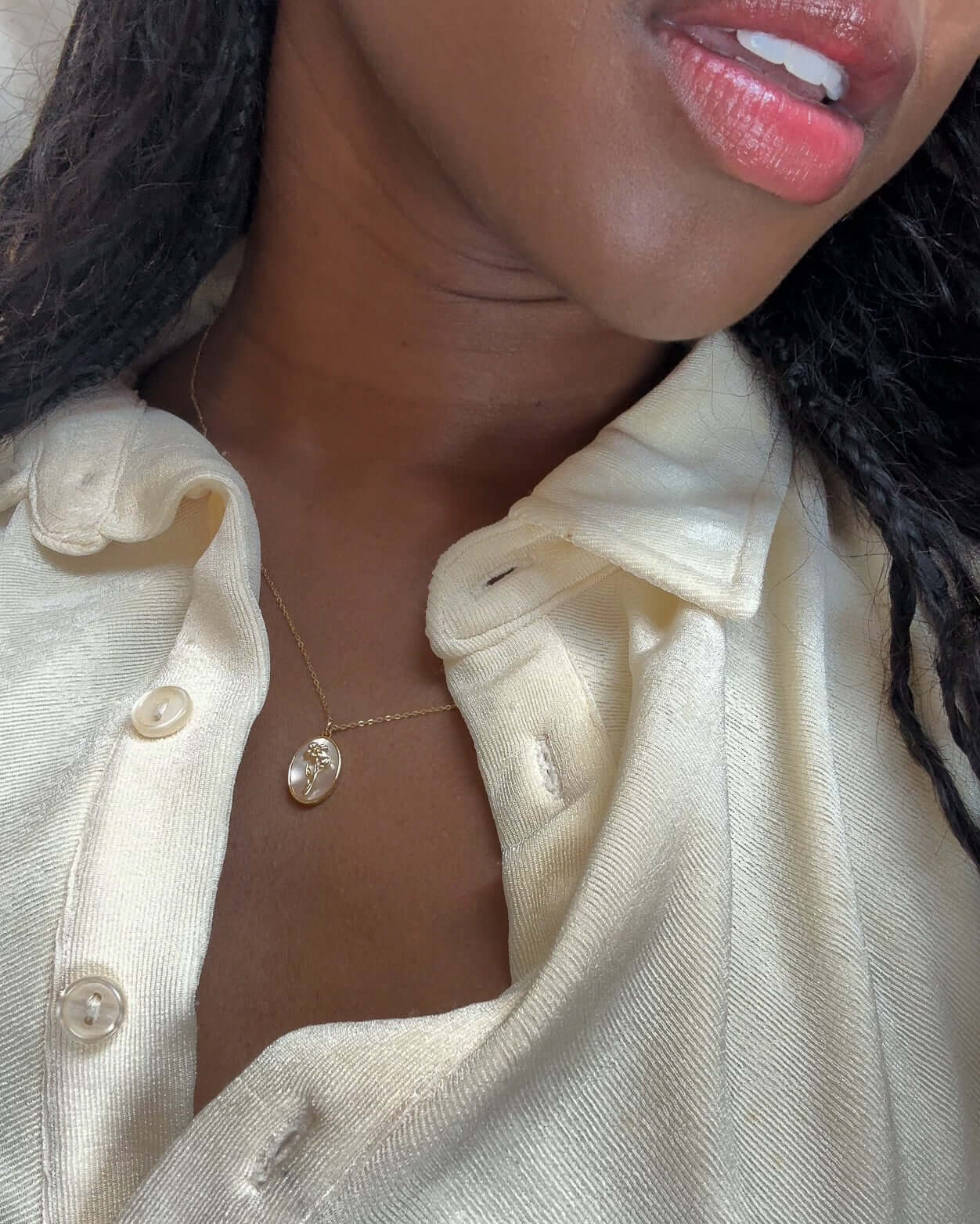 Katrina Birth Flower Necklace – Gold-Filled & Mother of Pearl showcased on a model's neck against a light shirt.