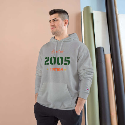 Limited Edition Year Hoodie – Champion Comfort, Collegiate Colors in gray worn by a model.