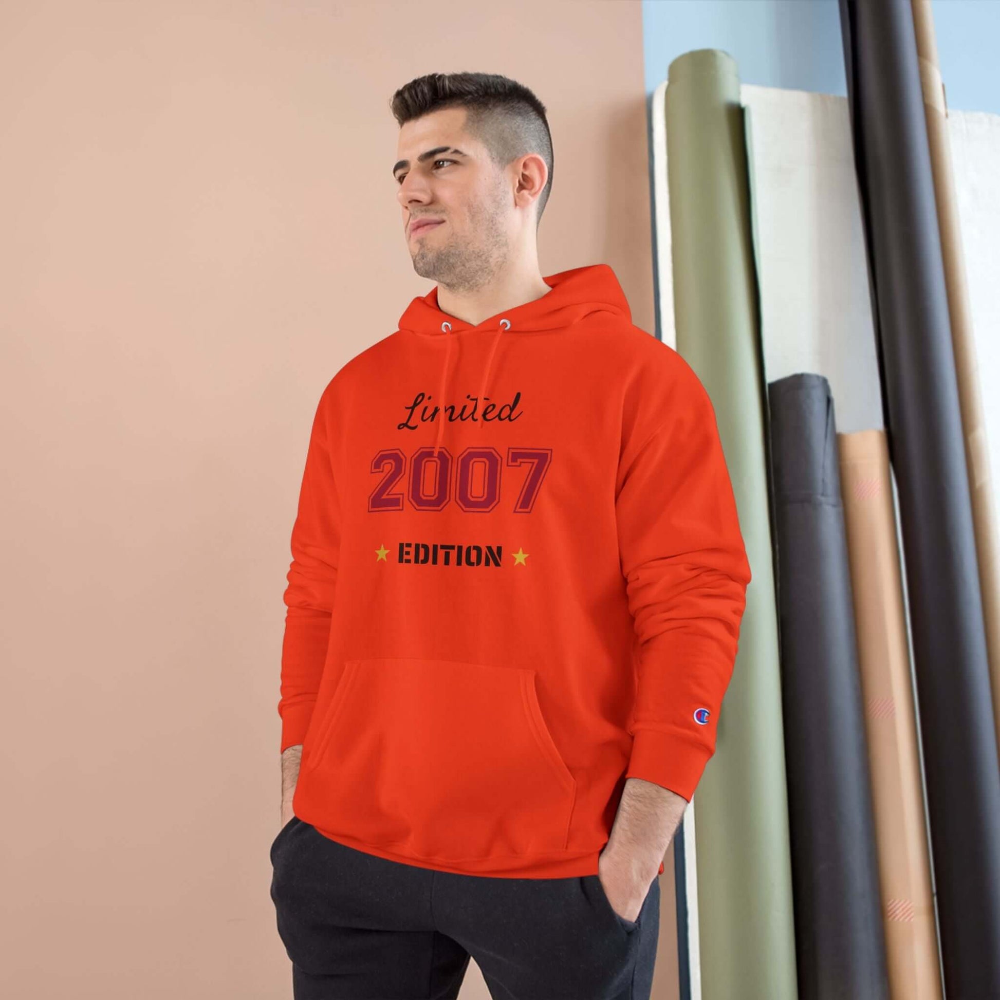 Man wearing Limited Edition Year Hoodie – Champion Comfort, Collegiate Colors in bold red with 2007 design.