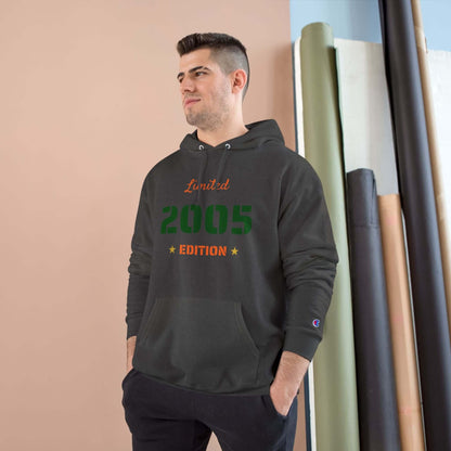 Limited Edition Year Hoodie – Champion Comfort, Collegiate Colors worn by a man in a stylish setting.