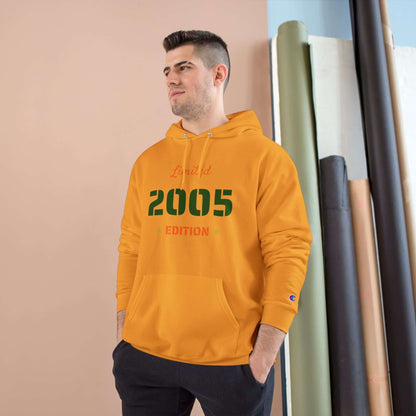 Limited Edition Year Hoodie – Champion Comfort, Collegiate Colors worn by a man in a room with neutral colors.