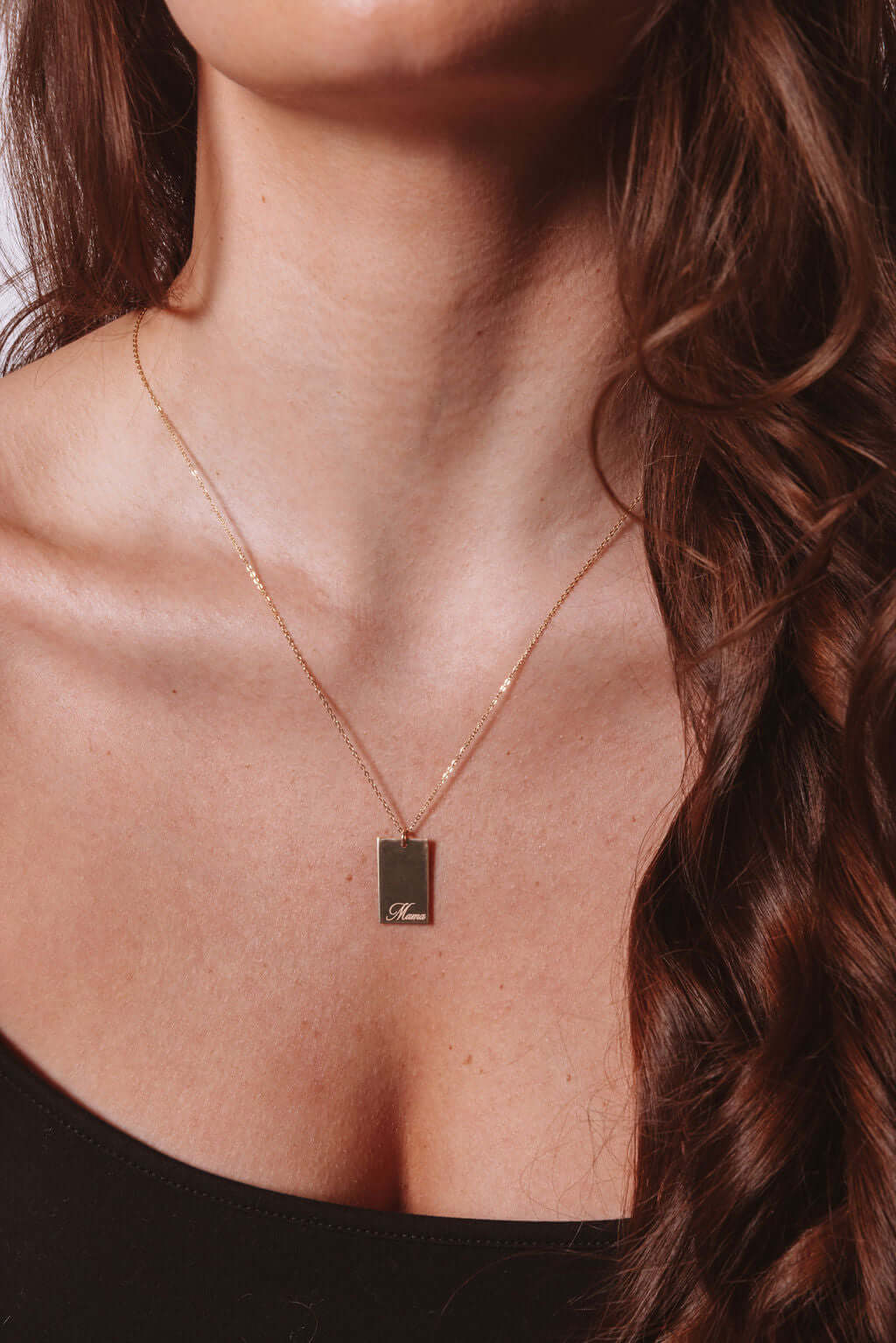 Mama Stella Necklace – 14k Gold-Filled Hand-Engraved Pendant worn on model showcasing its elegant design.
