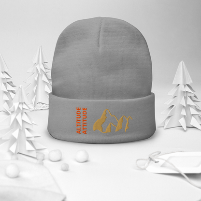 Mountain Beanie – Embroidered Knit Hat with Peak Style displayed with a cozy winter theme.