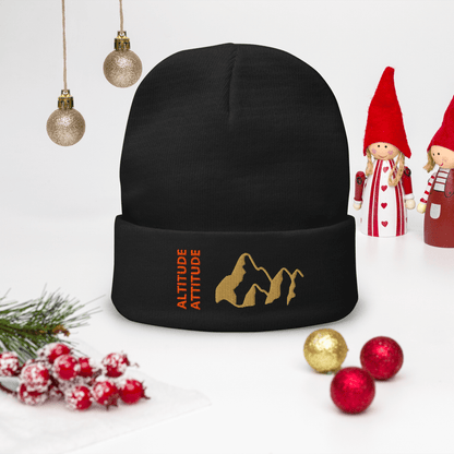 Mountain Beanie – Embroidered Knit Hat with Peak Style displayed on a festive table with ornaments.