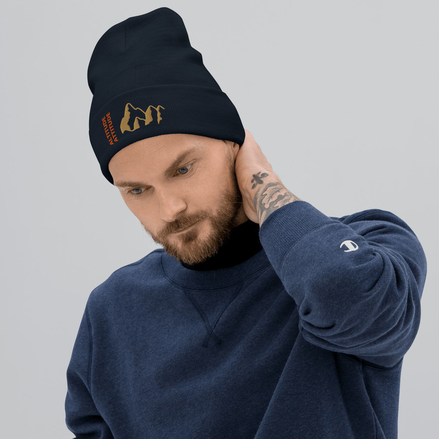 Mountain Beanie – Embroidered Knit Hat with Peak Style worn by a man with a stylish look.