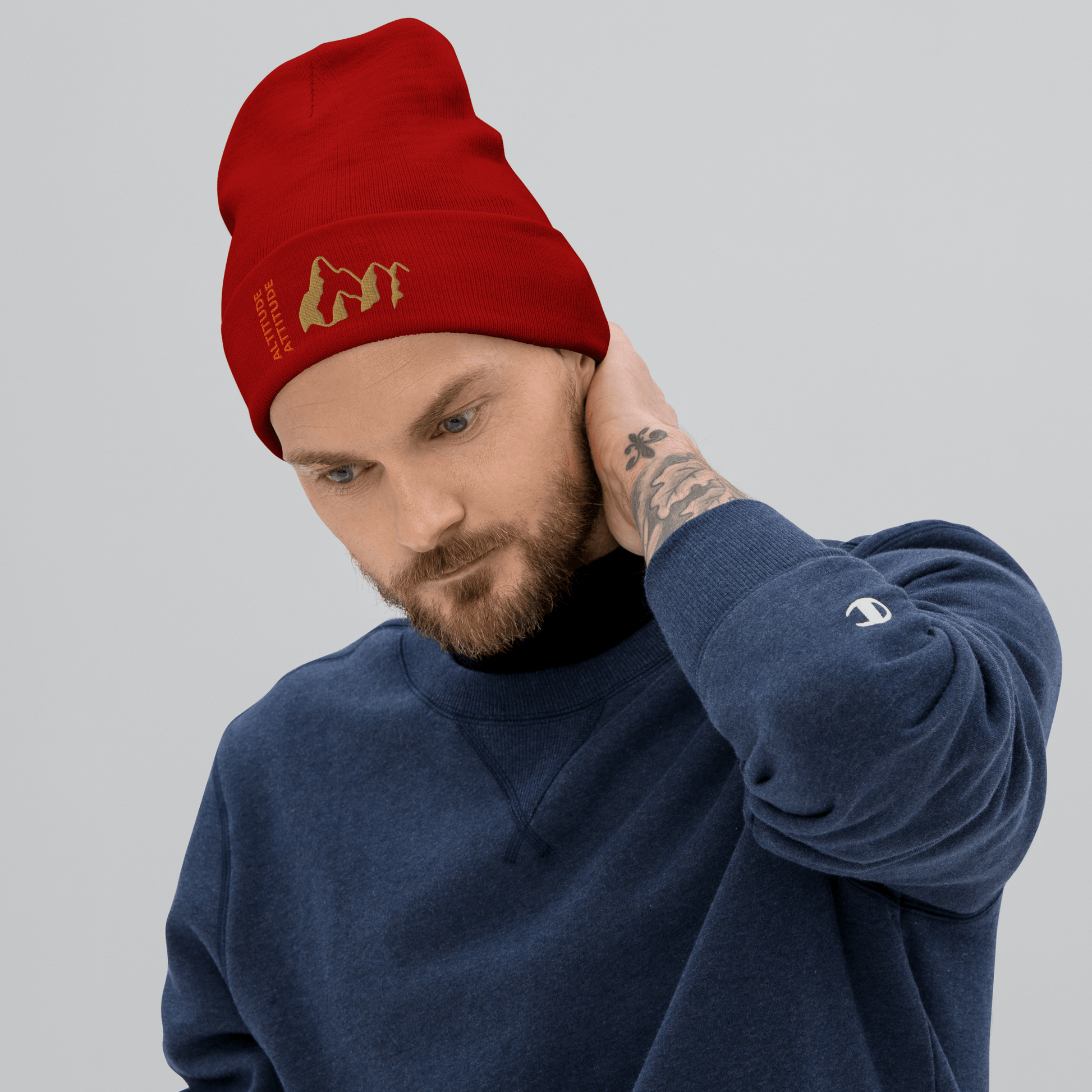 Mountain Beanie – Embroidered Knit Hat with Peak Style worn by a man in a red beanie and blue sweatshirt.