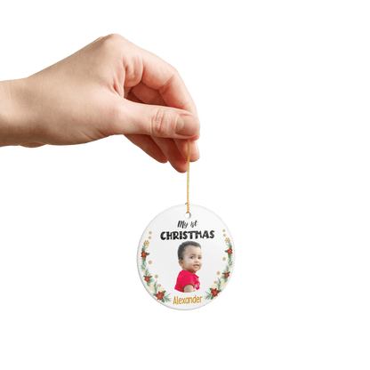 My 1st Christmas Ornament – Personalized Photo Keepsake held in hand displaying baby photo and name Alexander.