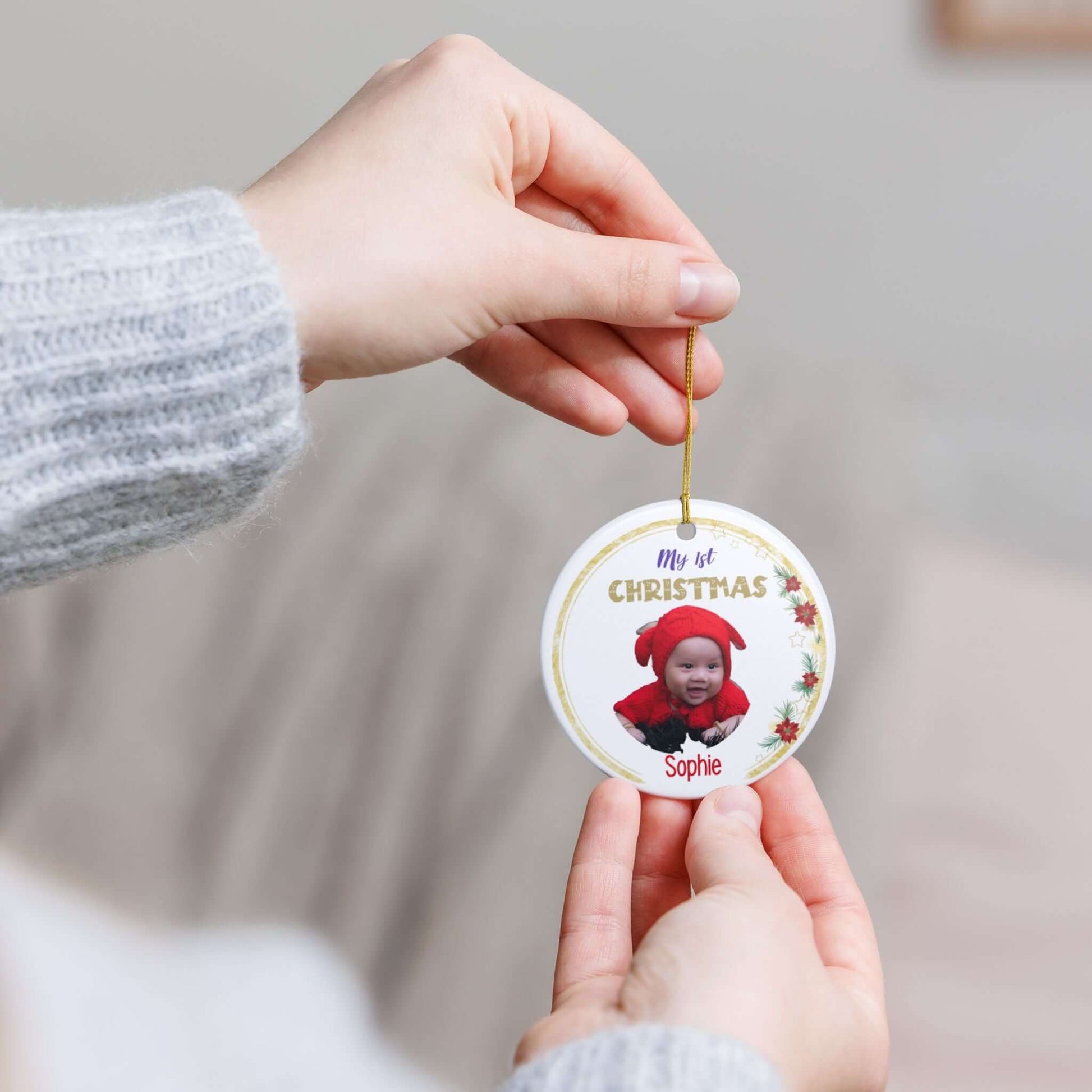My 1st Christmas Ornament – Personalized Photo Keepsake held by a person, featuring a baby's photo.
