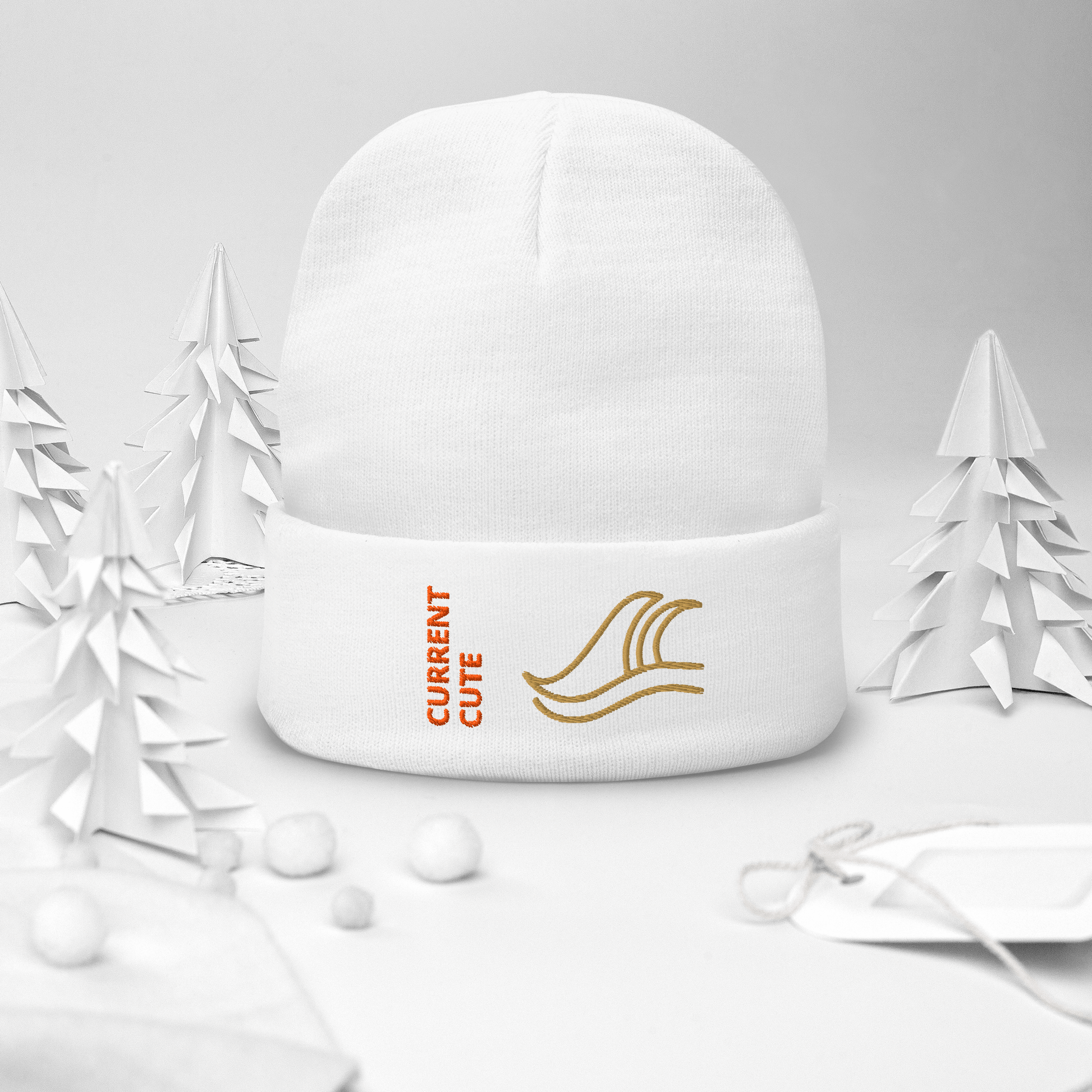 Ocean Waves Beanie – Embroidered Knit Hat with Custom Text in a snowy winter setting.