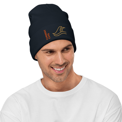 Ocean Waves Beanie – Embroidered Knit Hat with Custom Text being worn by a smiling man in casual attire.