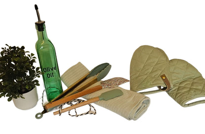 Personalized Home Warming Gift Basket with Engraved Cutting Board arranged with kitchen tools and accessories.