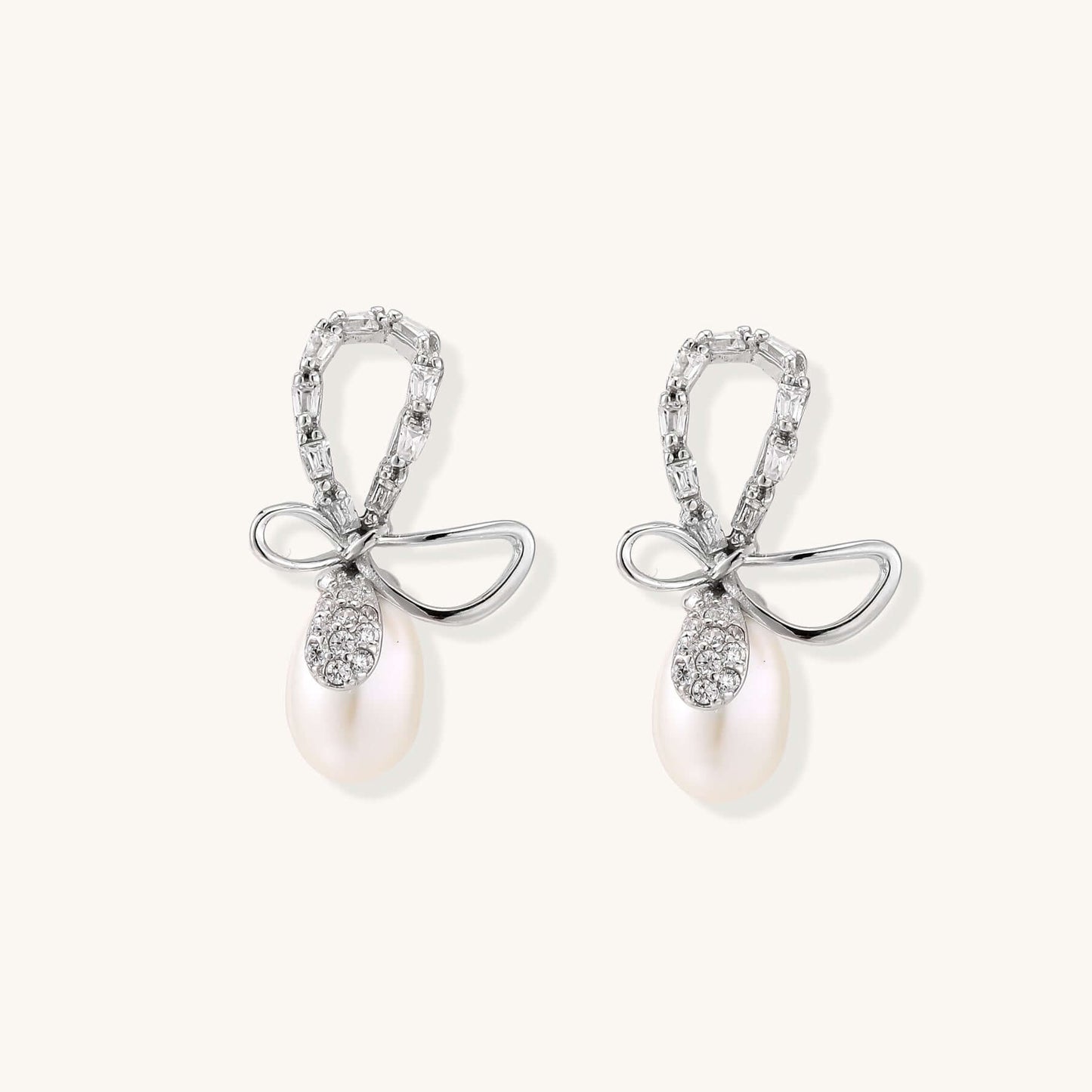 Pearl Drop Earrings with Crystal Bow Studs in Sterling Silver, featuring a bow stud and freshwater pearl.