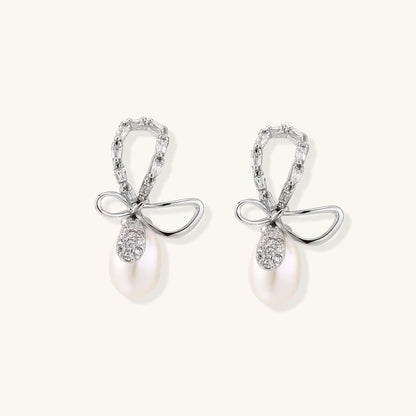 Pearl Drop Earrings with Crystal Bow Studs in Sterling Silver, featuring a bow stud and freshwater pearl.
