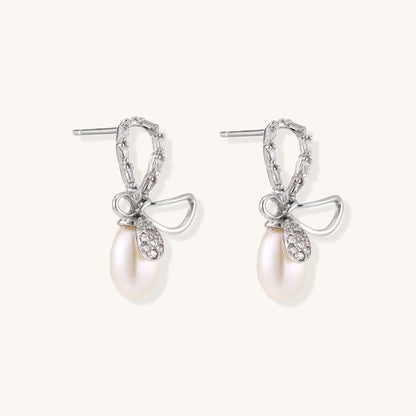 Pearl Drop Earrings with Crystal Bow Studs in Sterling Silver showcasing elegant design and luxurious freshwater pearls.