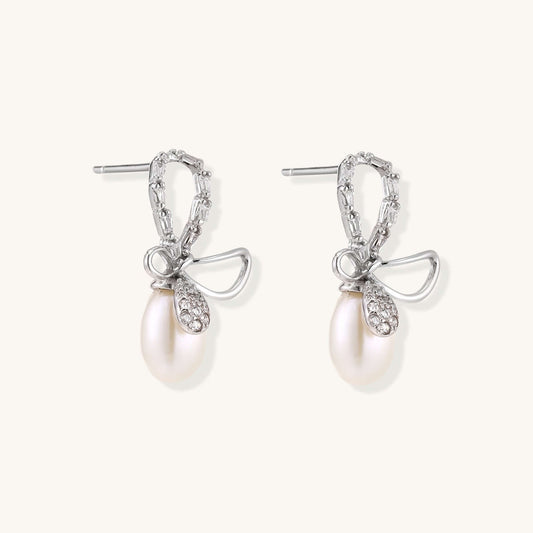 Pearl Drop Earrings with Crystal Bow Studs in Sterling Silver showcasing elegant design and luxurious freshwater pearls.