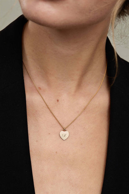 Alice Initial Necklace – Personalized 14k Gold-Filled Heart worn on a model, showcasing the heart charm with an initial.