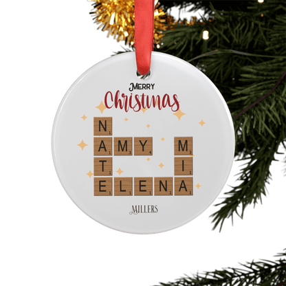 Personalized Acrylic Ornament with Family Crossword & Ribbon featuring family names in a crossword design.