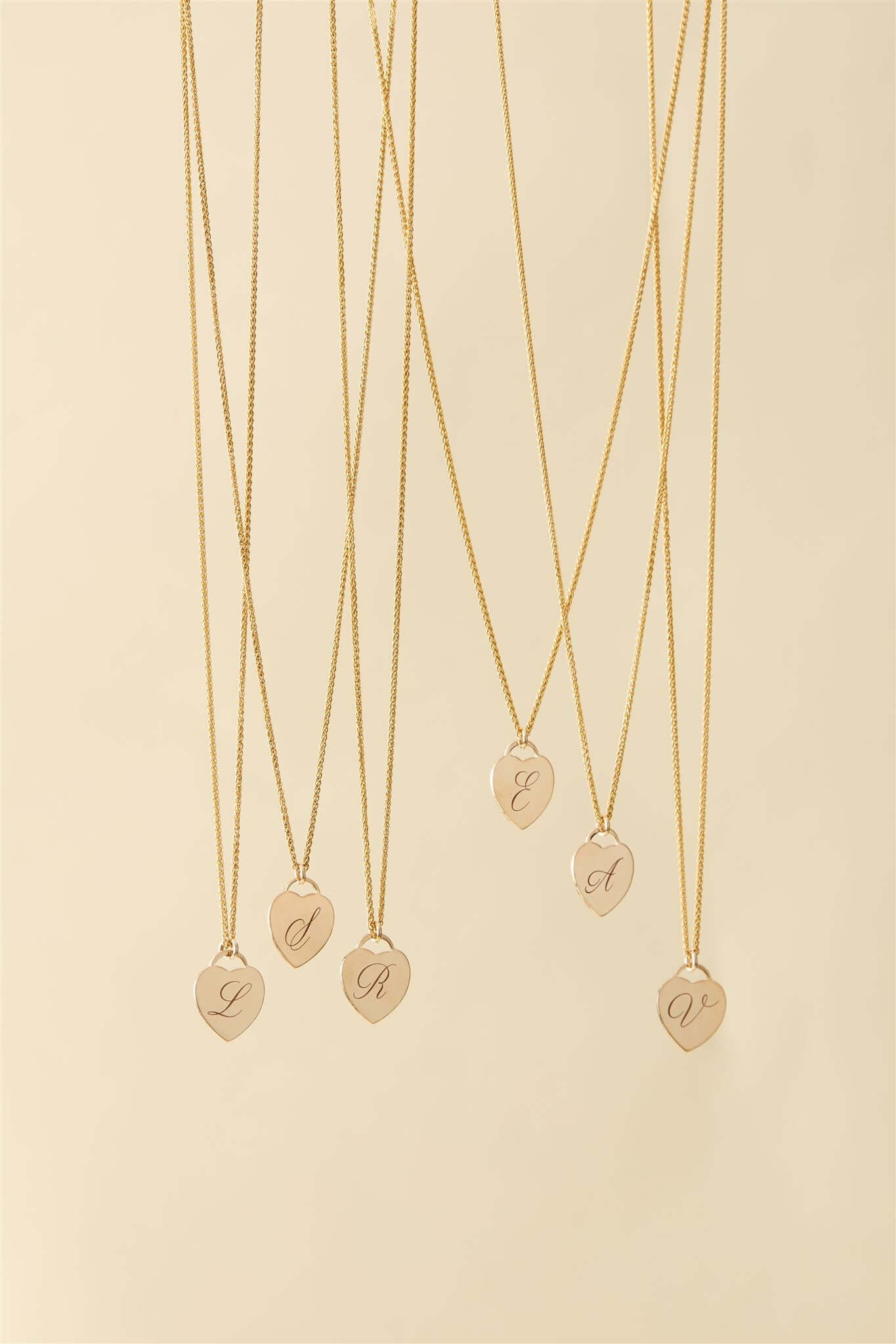 Alice Initial Necklace – Personalized 14k Gold-Filled Heart featuring engraved heart charms on wheat chains.