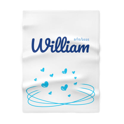 Personalized baby blanket with name William and date 9/15/2025, featuring a heart-themed design in blue.