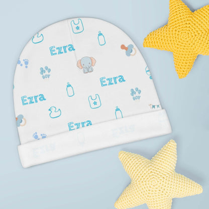 Personalized Baby Boy Beanie – Custom Name Infant Hat with blue nursery icons and name 'Ezra'.