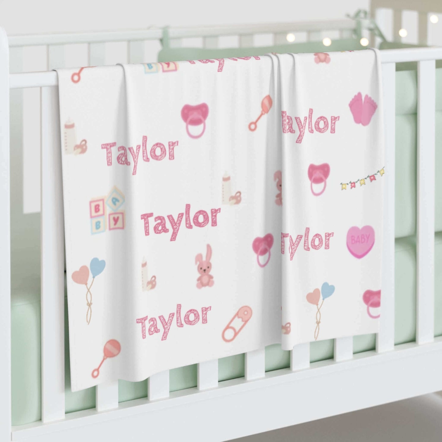 Personalized Baby Girl Blanket – Custom Name & Icon Design with playful nursery icons and the name Taylor.