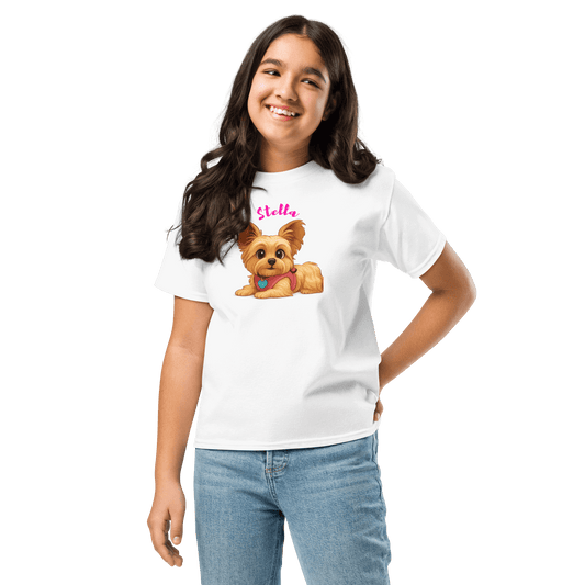 Girl wearing a personalized cartoon pet shirt featuring a cute dog illustration and custom name 'Stella'.