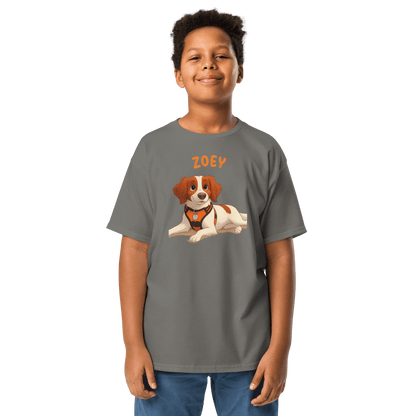Kid wearing a personalized cartoon pet shirt featuring a dog illustration and the name 'Zoey'.