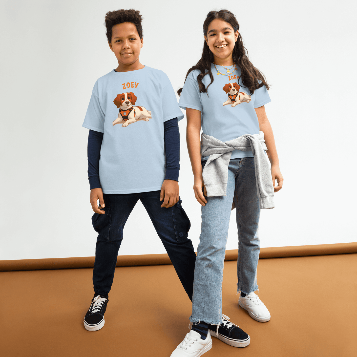 Kids wearing personalized cartoon pet shirts featuring a cute dog illustration and the name 'Zoey'.