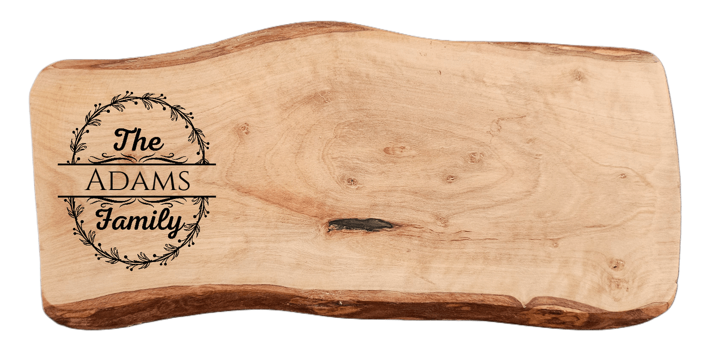Personalized Home Warming Gift Basket with Engraved Cutting Board featuring The ADAMS Family design on wood.