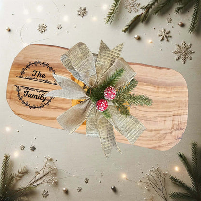 Personalized Family Name Gift – Olive Wood Set with bow and festive decorations on a light background.