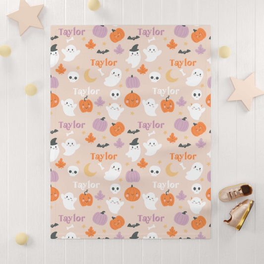 Personalized Halloween Baby Blanket – Ghost Parade Your Little Boo’s featuring playful ghosts and pumpkins with name Taylor.