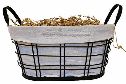 Personalized Home Warming Gift Basket with Engraved Cutting Board in a black wire frame with white cloth.