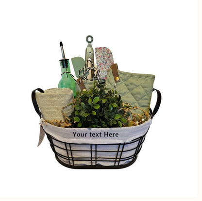 Personalized Home Warming Gift Basket with Engraved Cutting Board in a black wire frame with various home items.