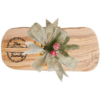 Personalized Family Name Gift – Olive Wood Set with decorative bow and holiday accents.
