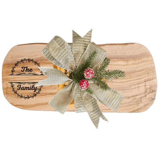 Personalized Family Name Gift – Olive Wood Set with decorative bow and holiday accents.