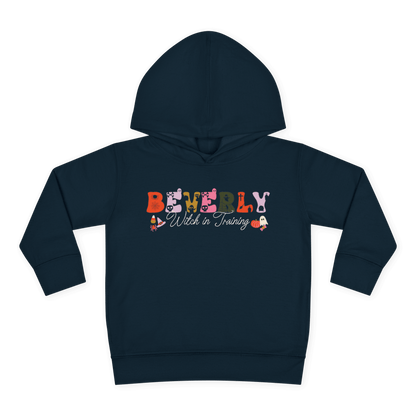 Spooky Toddler Hoodie – Personalized Halloween Pullover for Your Little Boo featuring name Beverly and Witch in Training design.