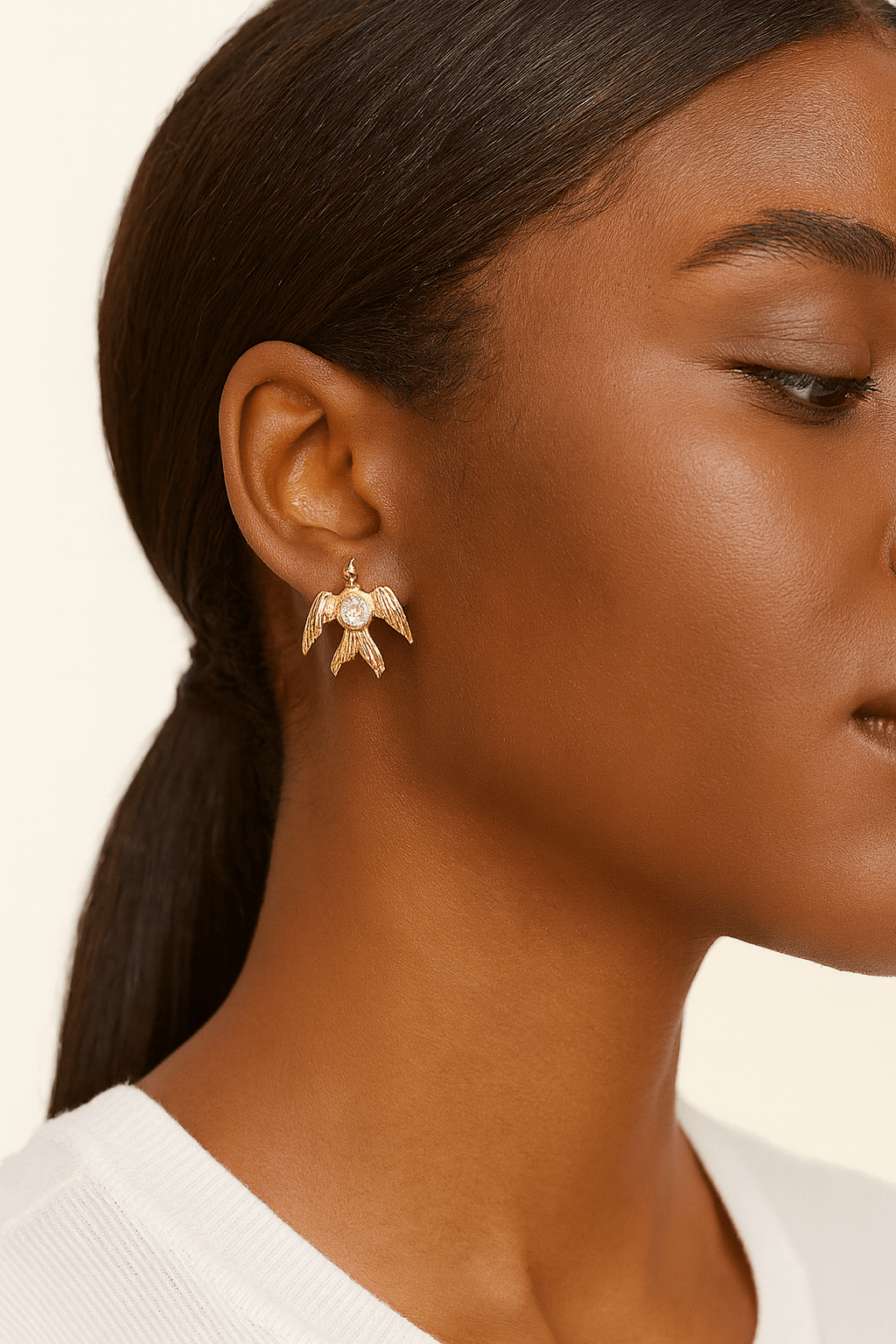 Phoenix Rising Studs with Angel Wings and Lavender Crystal Sparkle displayed on a model's ear.