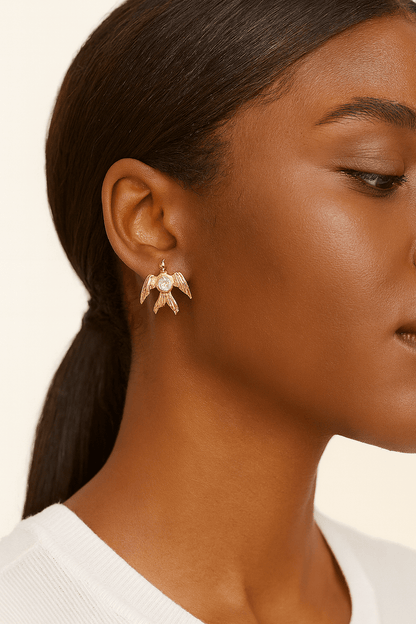 Phoenix Rising Studs with Angel Wings and Lavender Crystal Sparkle displayed on a model's ear.